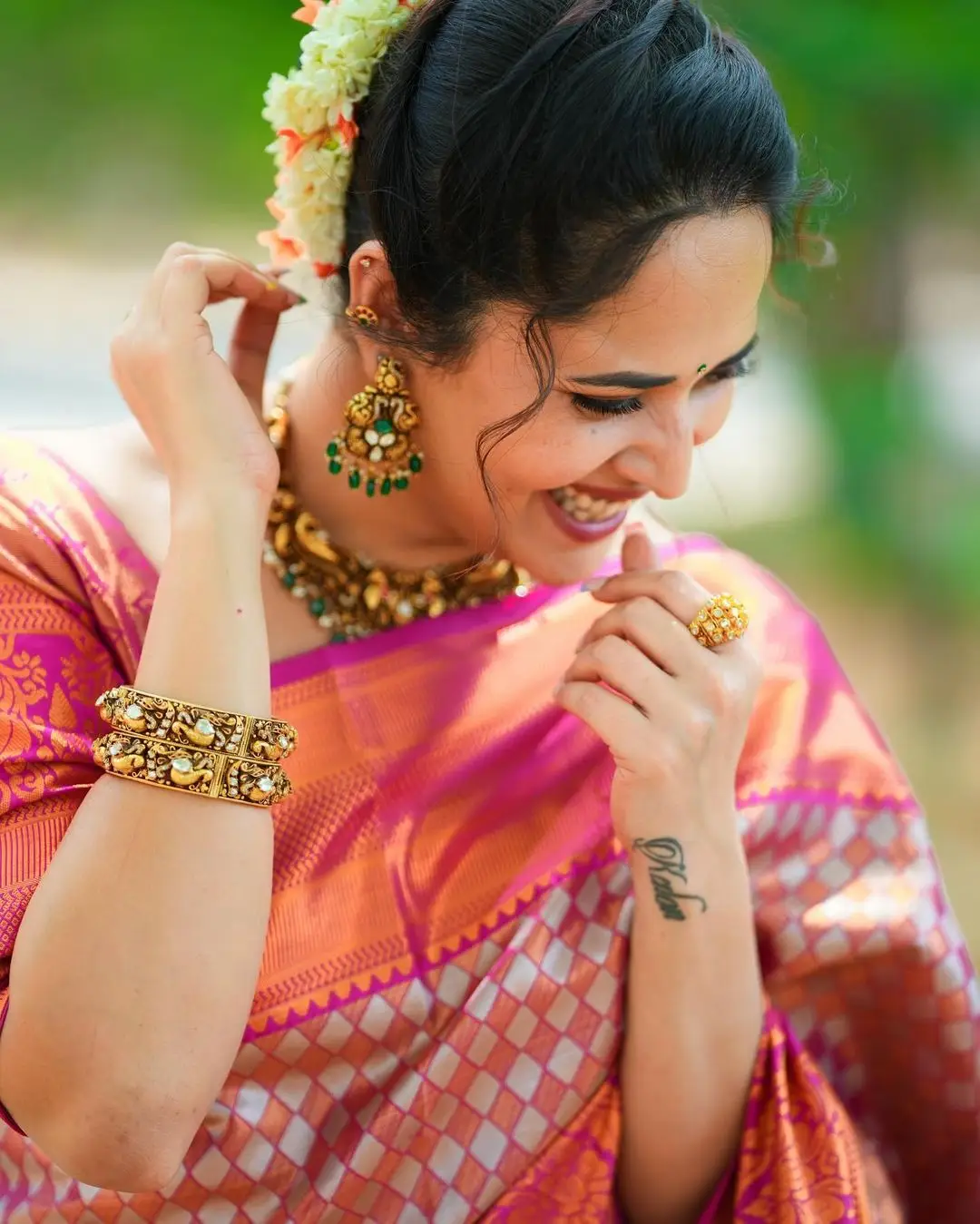 Maa TV Anchor Anasuya Bharadwaj in Orange Pattu Saree